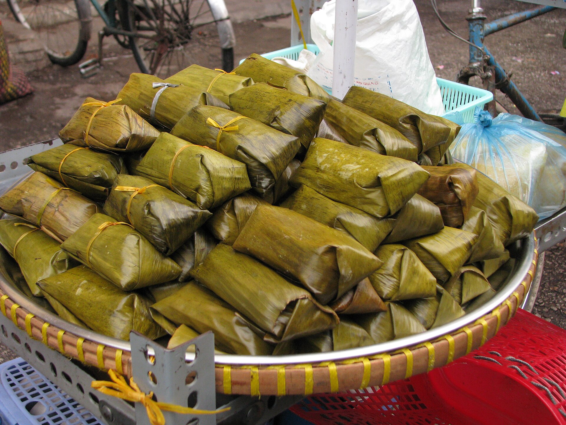 Sticky rice wrapped in banana leaves. Yummy and colourful food on display at the market in Chau Doc.